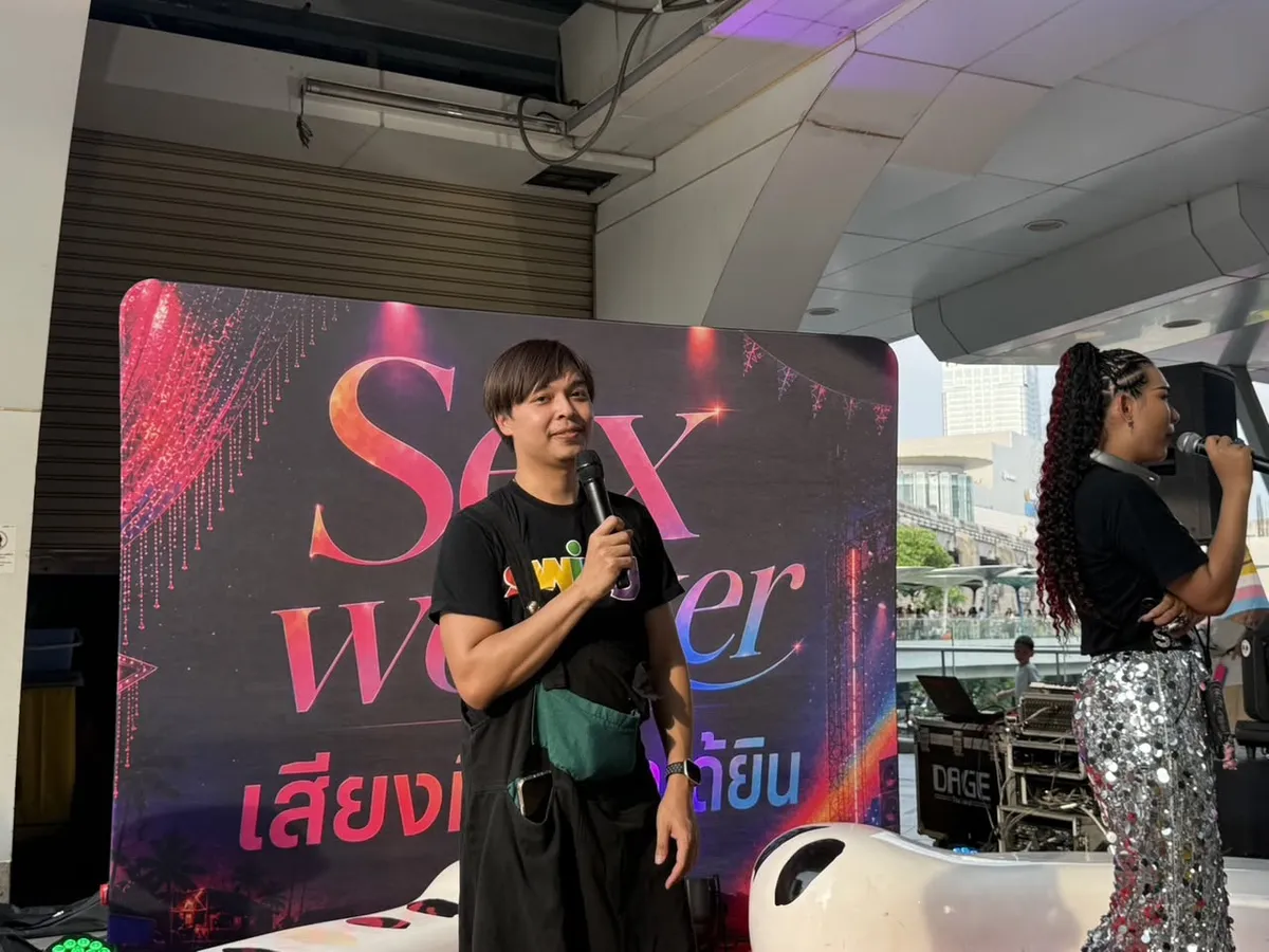 Arm holding a microphone at SWING's public forum on sex workers' voices